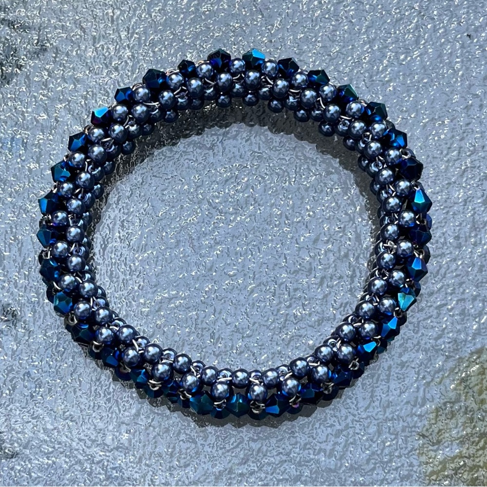 Blue simulated Pearl with sparkle bead rolling bracelet.